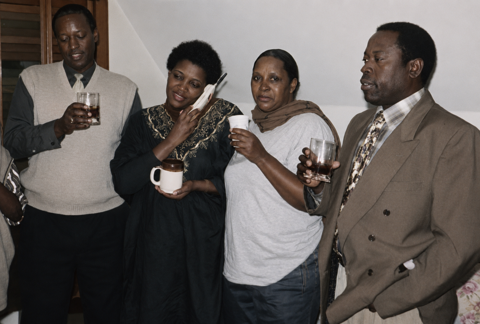 Henriette with friends and family at a gathering before 1994